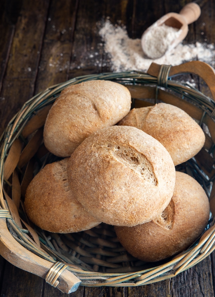 whole wheat buns in a blue basket.