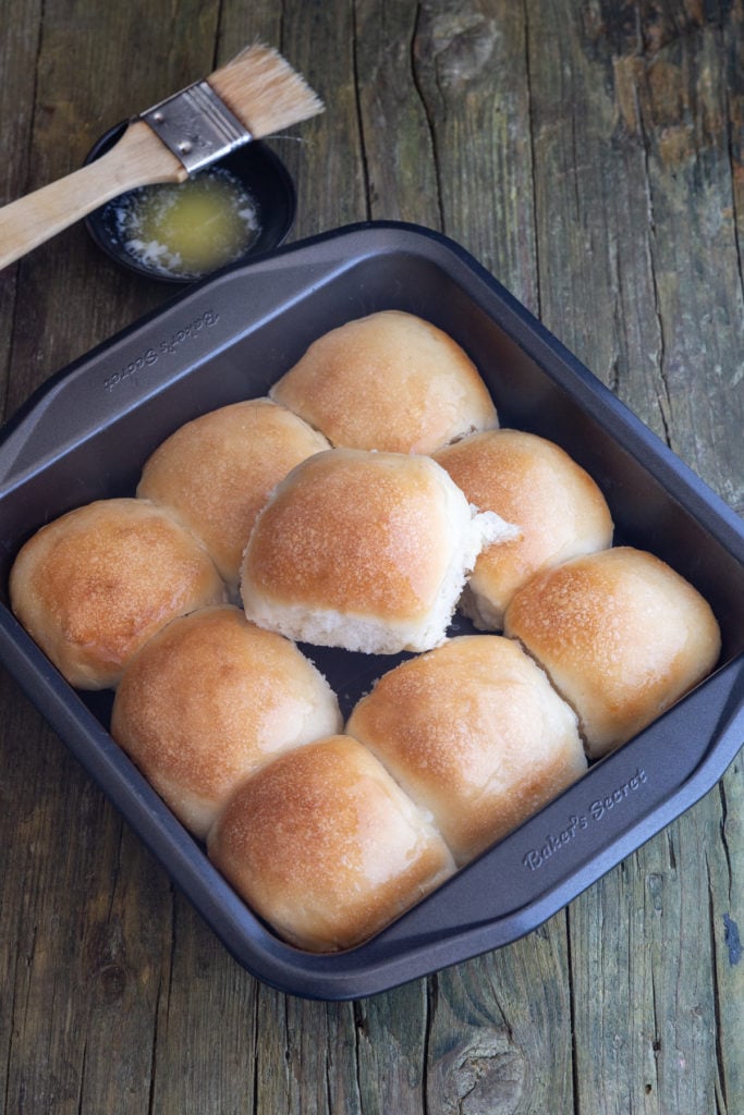 Dinner roll on the top of the others in the pan.