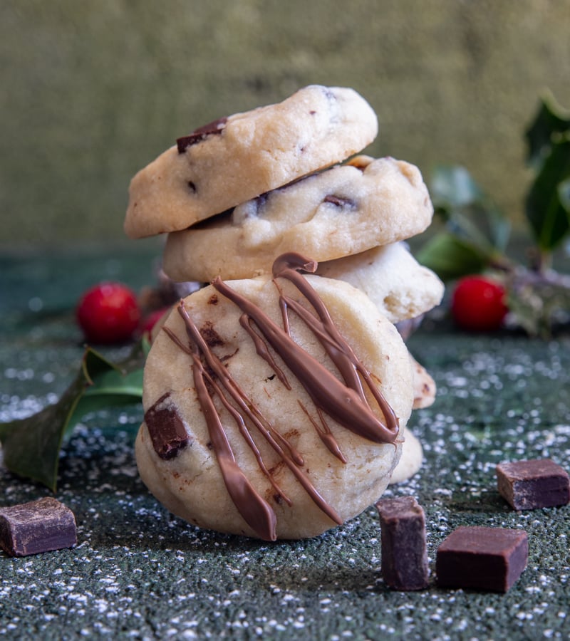 Chocolate chip shortbread with 5 stacked and one leaning.