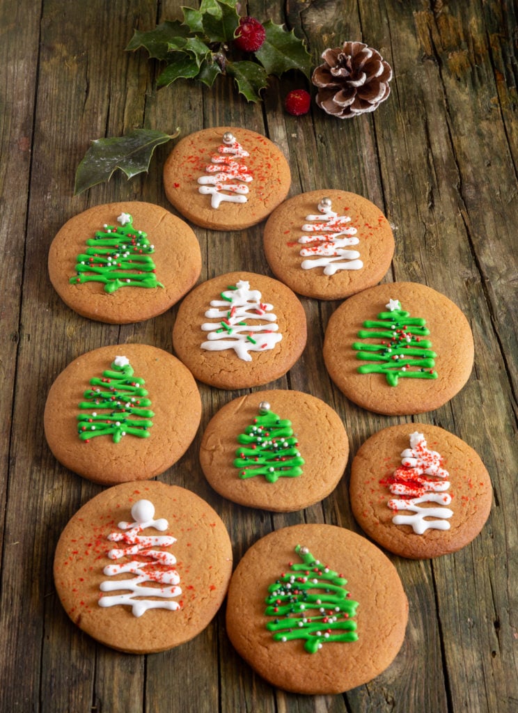 Gingerbread cookies on a green board.
